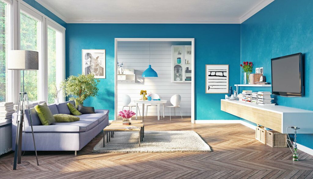 Living room with luxury vinyl flooring, blue walls, and modern furniture | Dalton Flooring of Georgia