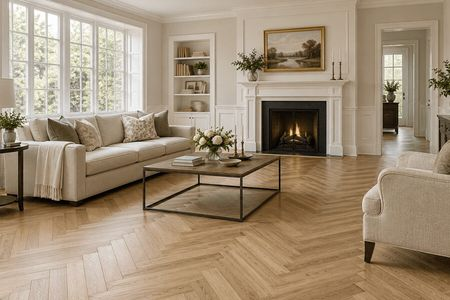 Elegant living room with herringbone wood flooring and a fireplace | Dalton Flooring of Georgia
